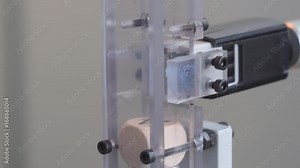 Printing on white model object, slow motion, closeup. Printing technology. Automatic printer