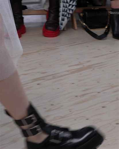 A cropped aviator jacket with a cocoon back and an asymmetric tiered skirt in ivory Paris net. Discover the #McQueenSS22 collection: on.alexandermcqueen.com/SS22_FB | Alexander McQueen