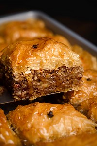 68K views · 922 reactions | Traditional Baklava, crispy, golden pastry, soaked in sweet honey syrup and layered with buttery phyllo, crunchy nuts (walnuts and almonds), and infused with spices (cinnamon and cloves). Is there a more cozy and festive dessert than this for Christmas? Full recipe here: https://realgreekrecipes.com/greek-baklava-recipe/ | Real Greek Recipes | Facebook