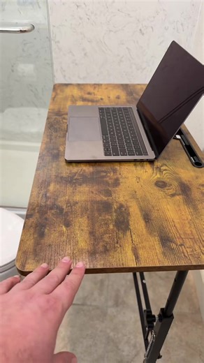 This small adjustable lightweight desk is an absolute must have if you work from home. It is height adjustable with four wheel, making it super easy to get to the right height and to move around. If you work from home or need to use your computer and multiple spots to the house. This is the desk to get. #StayAtHomeMom #WorkFromHome #HomeOffice #Desk