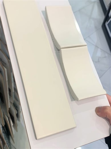 Modern Vertical Wall Tiles. Soft white, elongated tiles that add subtle texture and a clean, minimalist look—perfect for kitchens, bars, and accent walls. #HomeTileCenter #VerticalTile #ModernDesign #WhiteTile #InteriorInspo #TileDesign