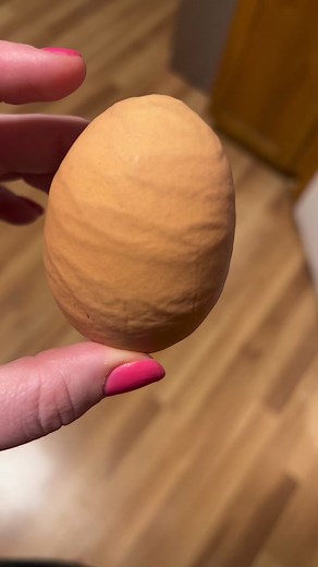 Unusual Find in the Chicken Coop: Ribbed Double Yolk Egg!