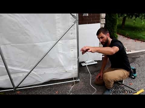 Installation des ancrages tige de métal pour abri auto