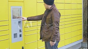 putting a parcel into a parcel station