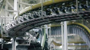 Complex machine spewing newspaper copies to the waiting distribution division. Quick and modern offset press speed the copies onto conveyor belt. High quality FullHD footage