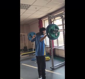 Man loses balance during heavy squat attempt in Inner Mongolia, China