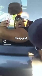 Woman cries victim when police break window for refusing to roll down window during traffic stop