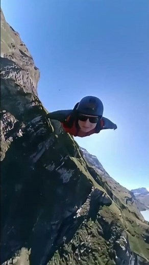 GoPro and Wingsuit Over the Mountains