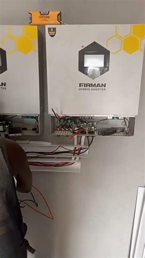 Connecting Parallel communication cable to four Firman hybrid inverter 11kw and load sharing cable.