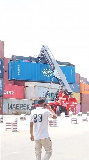 Kalmar Reach stacker with a tilting spreader for container handling