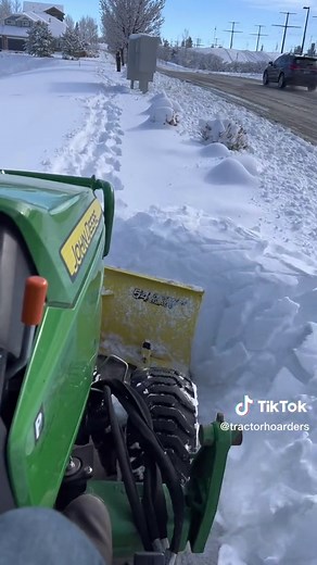 Clearing Neighborhood Sidewalks with John Deere 1025R