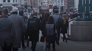 Net migration halves as fewer people come to UK for work and study