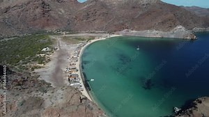 Flyover beach houses on secluded Playa El Burro on Baja California, MX
