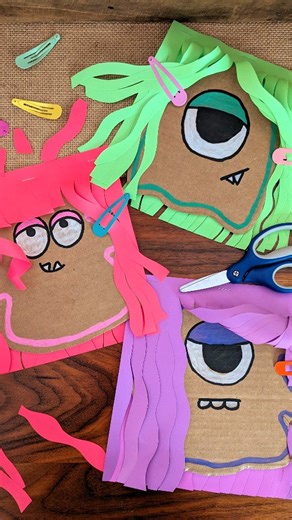 Jen Buchheit on Instagram: "Monster Haircut ✂️ This monster hair salon was so fun for Rosie and Mae! I took two pieces of paper and stapled them together. Then I cut waves in the paper from the bottom up to the staples. Between the layers of paper I put a cardboard monster face. The girls cut the monster's hair and styled it with pencil curls and clips! #kidcrafts #halloweencrafts #papercrafts #easycrafts"