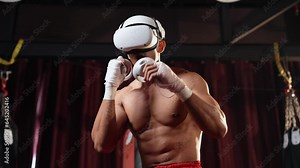 Boxer training utilizing VR technology or virtual reality, wearing VR headset with immersive boxing training technique using controller to enhance his skill in boxing simulator environment. Impetus Stock Video