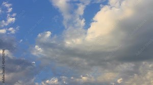 Rain clouds moving away fast motion. Time lapse of beautiful sliding, fleeing white clouds on the blue sky. 30 sec, 30 fps footage of HD timelapse cloudscape.