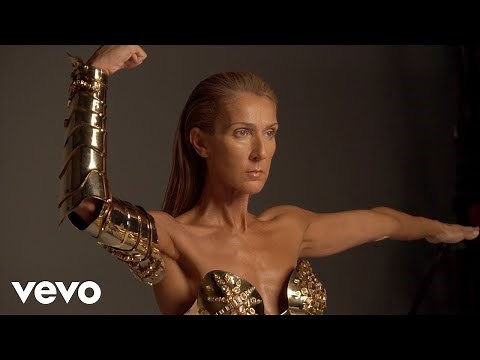 Behind-the-scenes of the Courage album photoshoot: Gold metal corset by Thierry Mugler