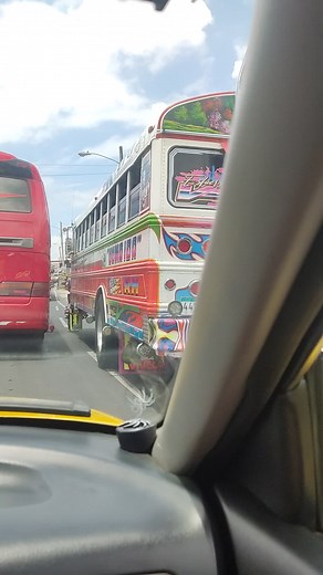 Colorful Cartoon Bus Journey: A Vehicle Perspective
