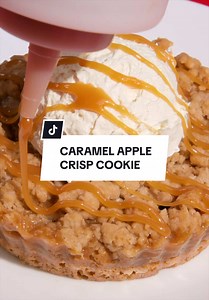 A classic American dessert baked into a cookie. Caramel Apple Crisp Cookie is here all week. Who's trying it first? 🍏👇 #Crumbl