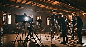 Audiovisual team with equipment recording a scene.