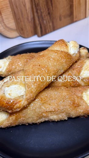 Authentic Pastelitos de Queso (Cream Cheese Pastries) 🇨🇺🔥 recipe ⬇️ 1 package puff pastry sheets, thawed 8 oz softened room temp cream cheese, sliced 1 large egg splash of water 1/2 cup turbinado sugar a little extra 1/2 cup sugar 1/2 cup water Slice cream cheese. Evenly sprinkle turbinado sugar on a cutting board or surface. Roll out thawed puff pastry dough directly onto the sugar to remove any creases. Cut into 4 large squares. Layer cream cheese in the middle of each square. Brush egg was