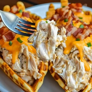 Irresistible Loaded Ranch Chicken Bacon Cheese Stuffed Waffle Cones Recipe Ingredients: 1. 8 waffle cones 2. 2 cups cooked chicken, shredded 3. 1 cup shredded cheddar cheese 4. 6 slices bacon, cooked and crumbled 5. 1/2 cup ranch dressing 6. 1/4 cup cream cheese, softened 7. 1/4 cup chopped green onions 8. Salt and pepper to taste Directions: 1. Preheat Oven: 1.1. Preheat your oven to 375°F (190°C) for that perfect golden crunch and melted cheese. Prepare the Chicken Mixture: 2. In a medium bowl