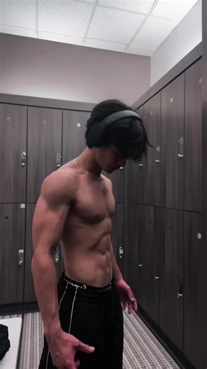 Showcasing Power: A Muscular Physique in the Locker Room