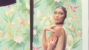 Bella Hadid models behind the scenes for Love Magazine shoot