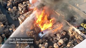 March 7, 2025 – Drone footage shows firefighters arriving at a pallet yard fire on the 100 South block of E Street with heavy smoke and flames threatening nearby businesses and vehicles. Additional footage captures crews responding to a commercial structure fire at E Street and Fourth Street, with fire showing from the second story as they work to gain access and contain the incident. Video Credit: @TheCadHound | San Bernardino County Professional Firefighters Local 935