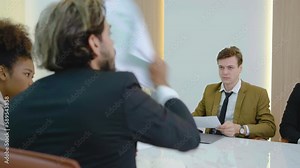 Angry diverse team colleagues argue over paperwork shouting during company business group meeting, mad annoyed coworkers disputing about documents quarreling shouting dissatisfied with bad teamwork