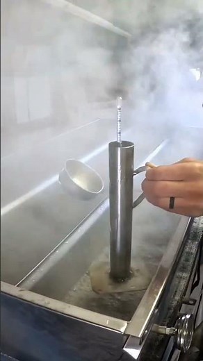 testing maple sap syrup with hydrometer