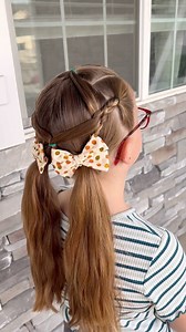 This girls pigtail hairstyle is unique and straight forward to do. I'm using a topsy tail to thread the hair through the braid. I love how this style turned out! | Easy Toddler Hairstyles