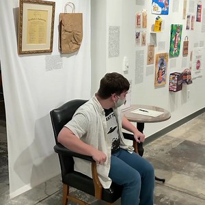 Have you sat on our paper bag yet? It’s located below a more famous but equally squished paper bag from the Conan O’Brien Show alongside signatures of celebrities who sat on the Conan bag - all in the Cultural Carry-On: America’s Literal Baggage exhibit. Come on in and give it a whirl! Video description: A person wearing a face mask sits down on a chair that has a paper bag on the seat. They then sigh their name on a paper on the table to the side of the chair. | Institute for Human Science and 