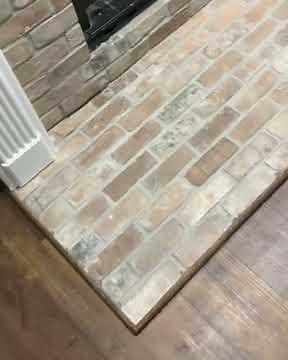 Brick veneer installation on fireplace