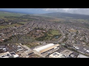 (HD) Flying over Kahului town Maui Hawaii from the air - Scenic flight