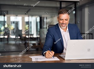 Middle-age Hispanic Man Using Laptop Computer Stock Photo 2349680475 | Shutterstock