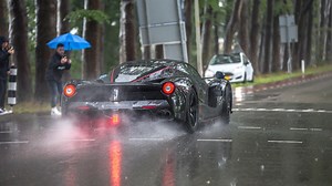 This video features 2 different Ferrari LaFerrari Aperta's which we saw this year and also in 2019 and 2018. In this video you can see one LaFerrari Aperta making an awesome powerslide in the rain and also some accelerations from both. The owner of the black LaFerrari Aperta is @ferraricollector on Instagram. | ExoticCarspotters