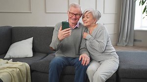 call. Happy senior couple woman man with smartphone having call. Mature old grandmother grandfather talking speaking online. Older generation modern tech usage. Virtual meeting online chat