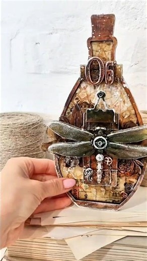 Mixed-media project with hdf bottle shape as a base with #finnabairproducts