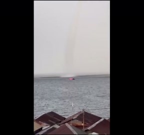 Towering waterspout tornado damages coastal homes