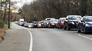 Miles-long backups for drive-through COVID testing in Maryland as virus surges