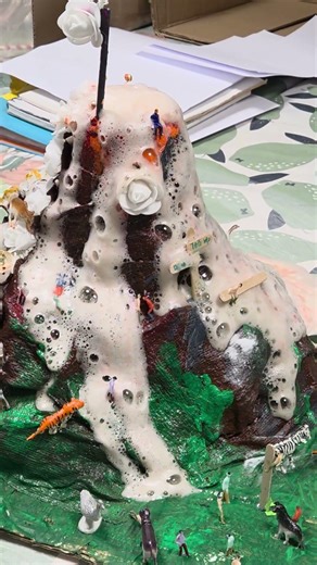 School made volcano - guess who they made to sit in the lava