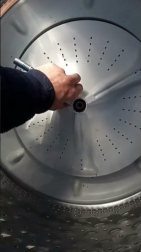 Maytag washer agitator disc removed with ratchet strap and wood