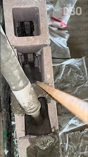 Concrete Filling Inside CMU Blocks | Reinforced Wall Construction Technique