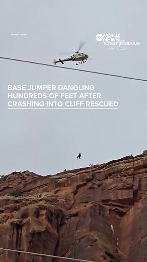 A #basejumper crashed into the side of a #cliff in Moab, #Utah, leaving him dangling hundreds of feet in the air until rescuers could reach him. With his #parachute tangled in the rocks, the chute’s thin cords kept him from hurtling to the jagged rocks below. Authorities launched a death-defying #rescue operation. One rescuer rappelled down the cliff face and tended to the injured jumper. After about two hours, both were whisked away in a helicopter and pulled to safety. Officials said the base
