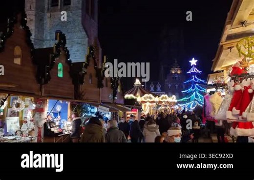 Bethune, France - 23 December 2021: Christmas market in the Grand Place square. The annual event includes wooden chalets and fairytale settings Stock Video Footage - Alamy