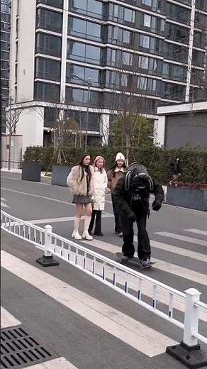 🥳🎉🥰Bike rider poses in front of girls.