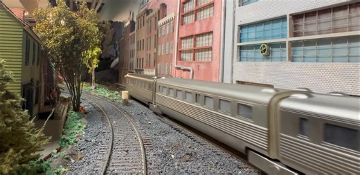 The Flying Yankee approaches through the industrial part of town. | Cherry Valley Model Railroad