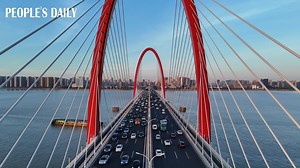 The 4.7-km-long Zhijiang Bridge, arching over the Qiantang River in Hangzhou, east China's Zhejiang Province, boasts an exquisite architectural design that looks spectacular from a distance. | People's Daily, China