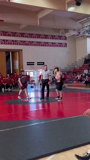 Exciting Wrestling Match Highlights in Gymnasium